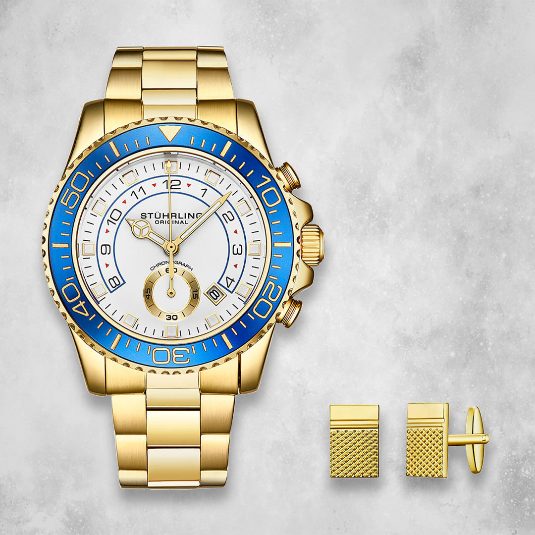 Gold watch and cufflinks on a light gray background