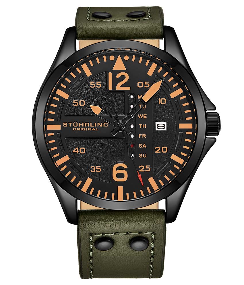 A Stühling watch with a black dial, orange hands, and a green genuine leather strap.