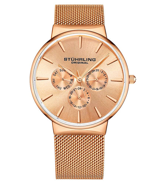 A rose gold Stühling watch with a mesh bracelet and a polished bezel, featuring a silver dial with rose gold hands and markers.